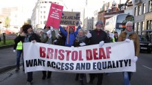 LS_BSL_March_Road_Colston_Ave_protesters_walking_long_banner