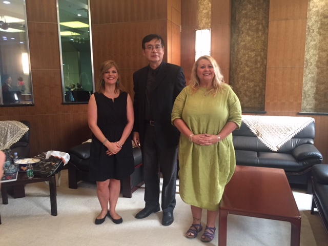 With director of shanghai deaf association as well as deputy director of China deaf association